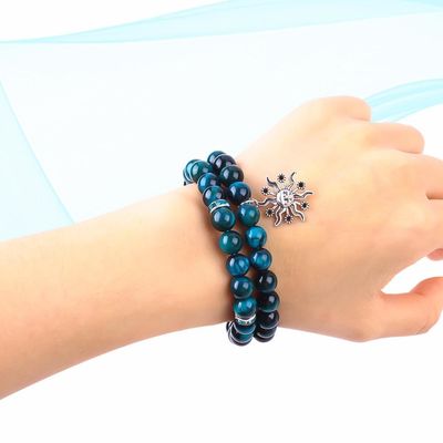 El brazalete de la mano de la piedra de la cara del tigre azul turquesa redonda elástica con cuentas