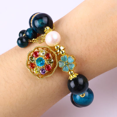 14MM Cristales de curación energética Ojo de tigre azul de flor giratorio Brazalete de perlas de encanto para el uso diario