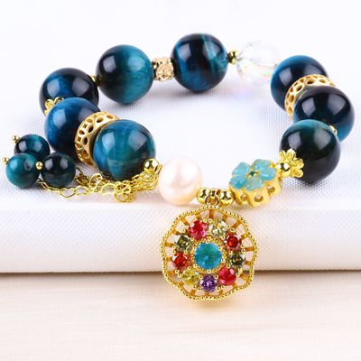 14MM Cristales de curación energética Ojo de tigre azul de flor giratorio Brazalete de perlas de encanto para el uso diario