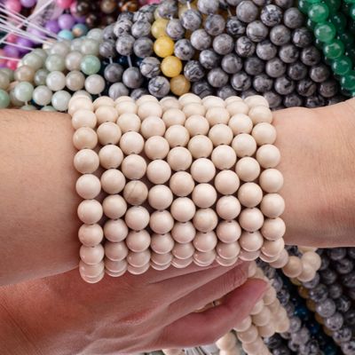 Piedra natural de color blanco pulido Fósil de río Jaspe redondo Perlas sueltas para la fabricación de joyas