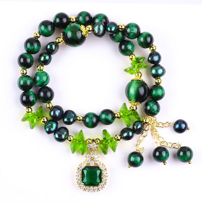 Es una pieza hecha a mano de piedra preciosa con cuentas, brazalete natural, ojo verde de tigre, brazalete de piedra ajustable, brazalete de amuletos para la fiesta diaria.