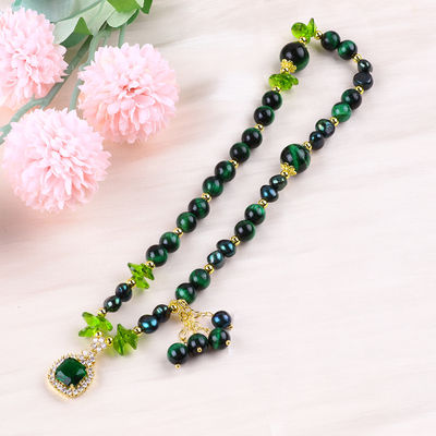 Es una pieza hecha a mano de piedra preciosa con cuentas, brazalete natural, ojo verde de tigre, brazalete de piedra ajustable, brazalete de amuletos para la fiesta diaria.