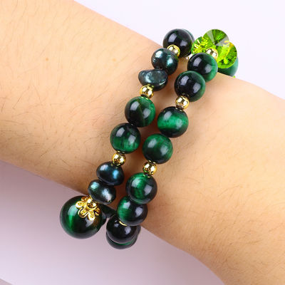 Es una pieza hecha a mano de piedra preciosa con cuentas, brazalete natural, ojo verde de tigre, brazalete de piedra ajustable, brazalete de amuletos para la fiesta diaria.