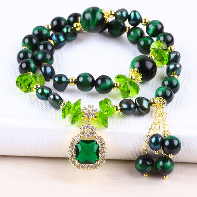 Es una pieza hecha a mano de piedra preciosa con cuentas, brazalete natural, ojo verde de tigre, brazalete de piedra ajustable, brazalete de amuletos para la fiesta diaria.