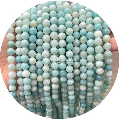 Venta al por mayor Natural 2A Flor de ciruela Turmalina Redonda Perlas sueltas Piedra de luna Florita Piedra de sol Perlas espaciadoras para joyas
